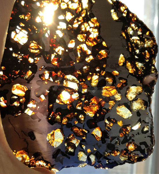 Photo of light shining through a meteorite